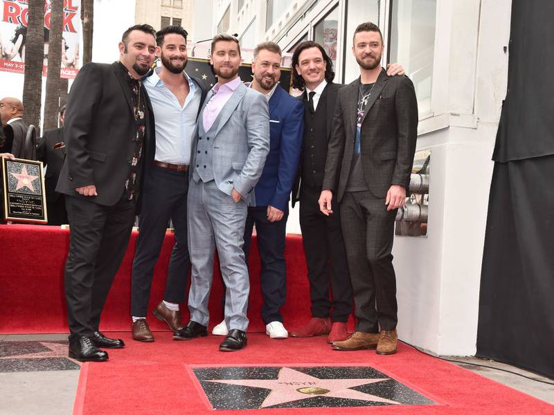 HOLLYWOOD, CA - APRIL 30:  (L-R) Members of the iconic 90's boyband *NSYNC, Chris Kirkpatrick, Lance Bass, JC Chasez, Joey Fatone and Justin Timberlake (along with Lance Bass' husband, Michael Turchin, second from left) were honored with a star on the Hollywood Walk of Fame on April 30, 2018 in Hollywood, California.  (Photo by Alberto E. Rodriguez/Getty Images)