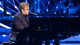 Fans "won't have to wait too long" for new Elton John music, says his husband