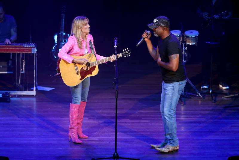 NASHVILLE, TENNESSEE - JUNE 06: Sheryl Crow and Darius Rucker perform onstage for the 2022 Darius and Friends Concert benefitting St. Jude Children's Research Hospital at Ryman Auditorium on June 06, 2022 in Nashville, Tennessee. (Photo by Jason Kempin/Getty Images for Essential Broadcast Media)