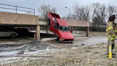 Photos: Truck slides off Tulsa parking structure