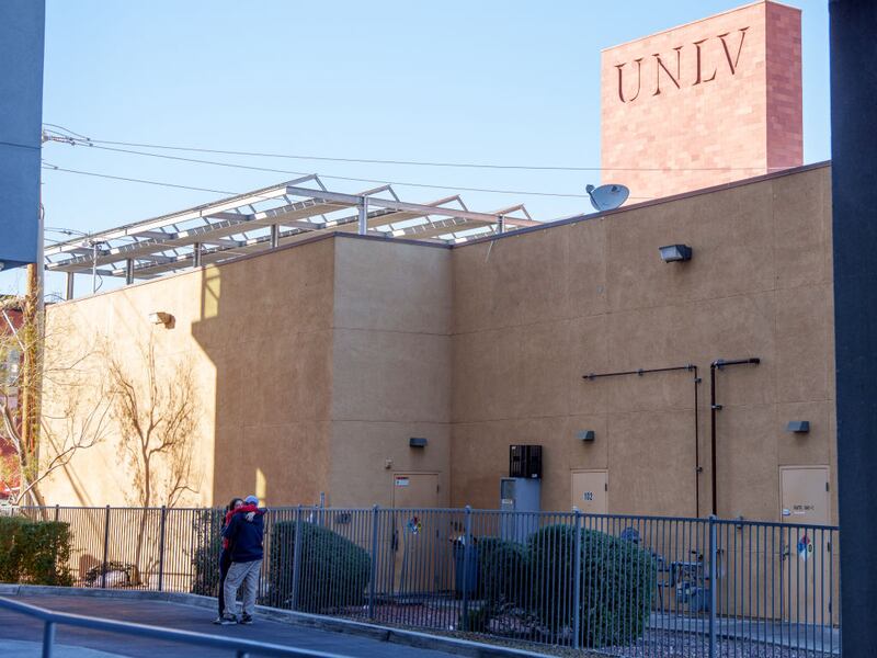 LAS VEGAS, NEVADA - DECEMBER 06: UNLV students Sierra Connor and Wesley Harden embrace on the outskirts of the UNLV campus after a shooting on December 06, 2023 in Las Vegas, Nevada. According to Las Vegas Metro Police, a suspect is dead and multiple victims are reported after a shooting on the campus. (Photo by Mingson Lau/Getty Images)