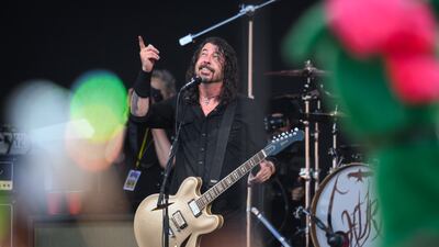 GLASTONBURY, ENGLAND - JUNE 23: Dave Grohl of the Foo Fighters gestures to the sky after referring to the late drummer Taylor Hawkins as the band perform on the Pyramid Stage on Day 3 of Glastonbury Festival 2023 on June 23, 2023 in Glastonbury, England. The Glastonbury Festival of Performing Arts sees musicians, performers and artists come together for three days of live entertainment. (Photo by Leon Neal/Getty Images)